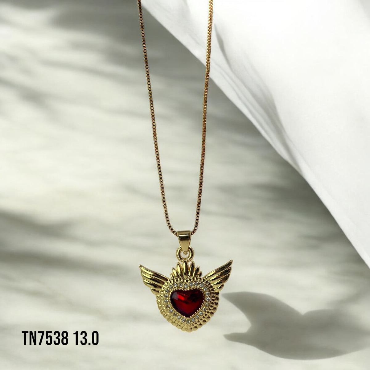 Collar corazón dorado y rojo